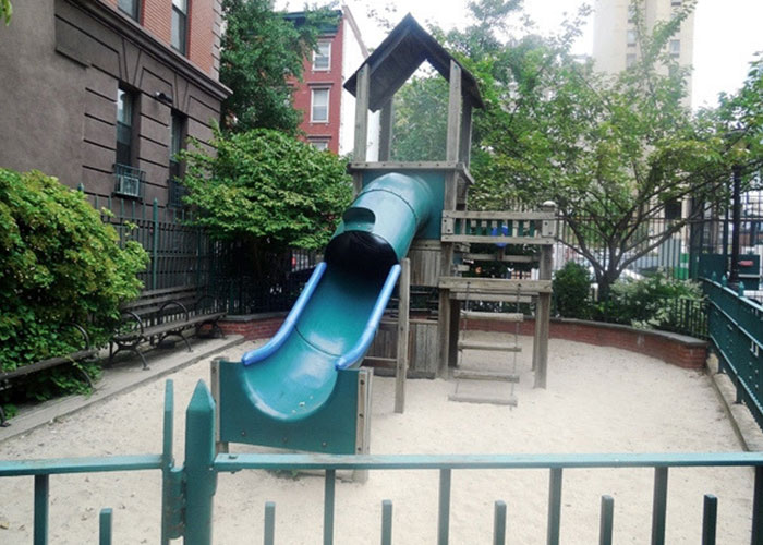 Photo of an outdoor play area for kids with slide.